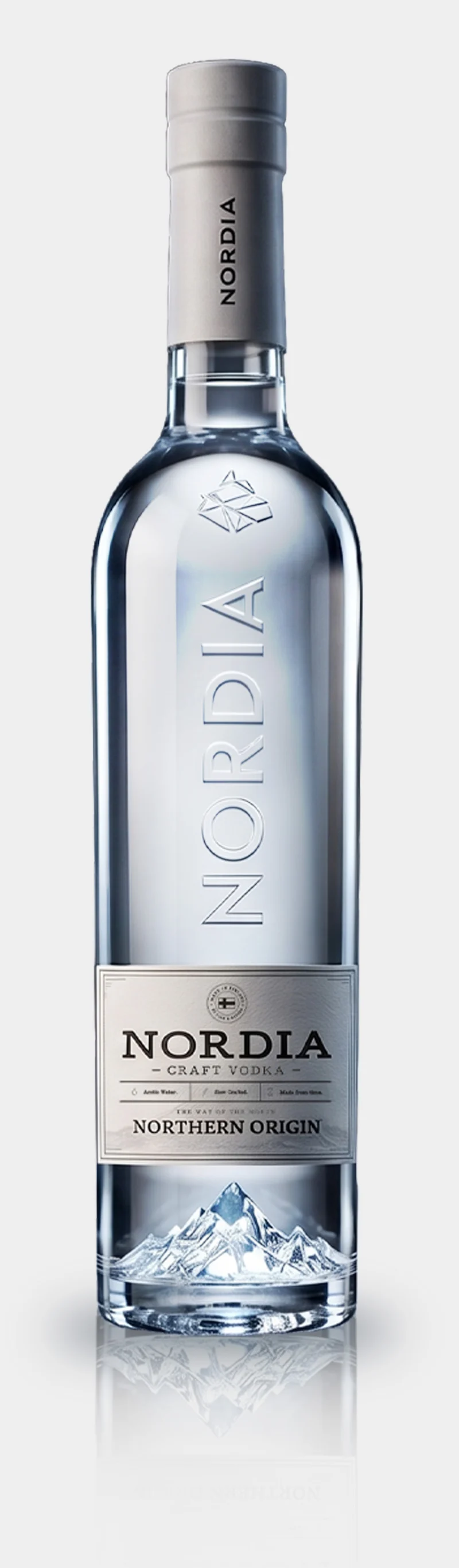 The NORDIA Craft Vodka bottle: silver capsule, embossed glass, Northern Origin label and a sculpted glacier in the base.