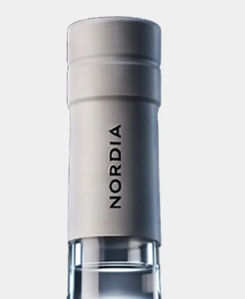Close-up of the silver NORDIA capsule.