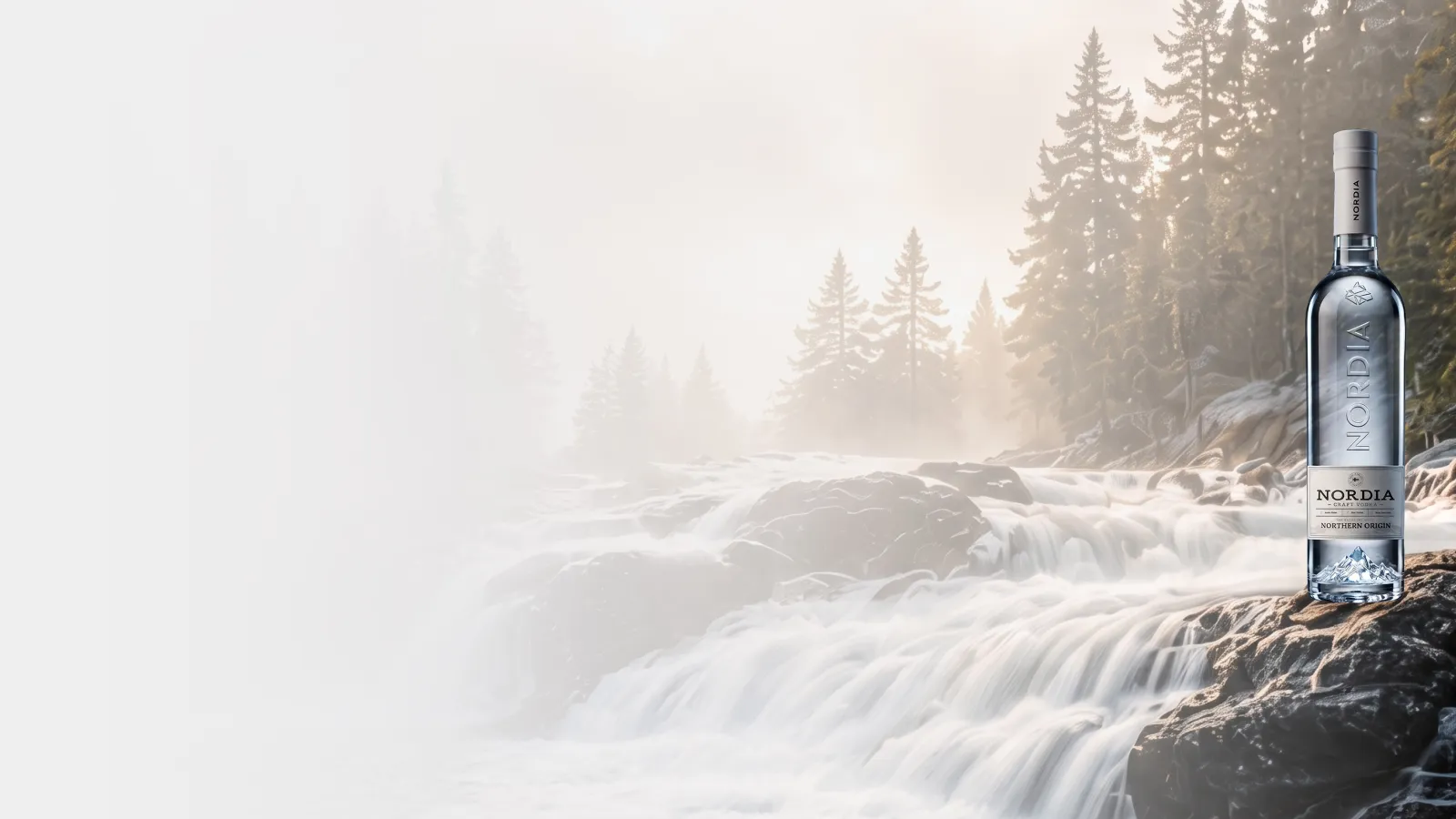 NORDIA beside a misty forest waterfall.