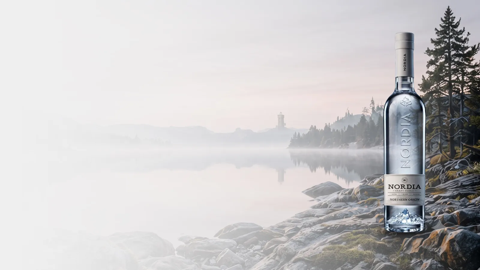NORDIA on a rocky shore above a misty lake.